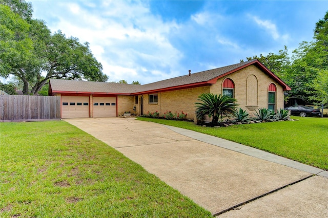 view of front of property with an attached garage, driveway, and brick siding