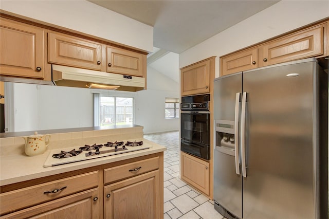 kitchen featuring stainless steel fridge, oven, a warming drawer, white gas cooktop, and under cabinet range hood
