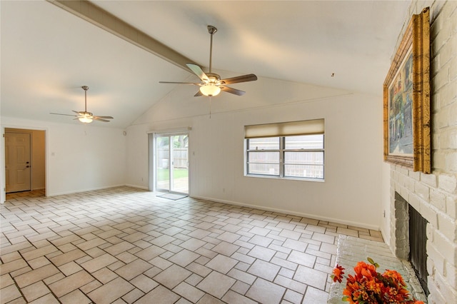 unfurnished living room with ceiling fan, baseboards, a large fireplace, beamed ceiling, and high vaulted ceiling