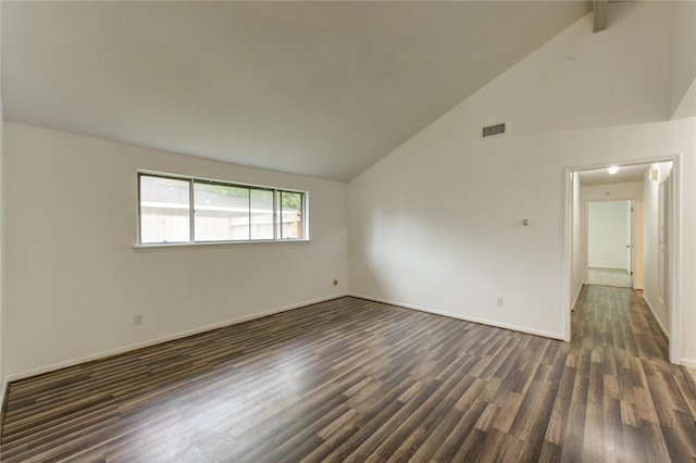 spare room with dark wood finished floors, high vaulted ceiling, and baseboards
