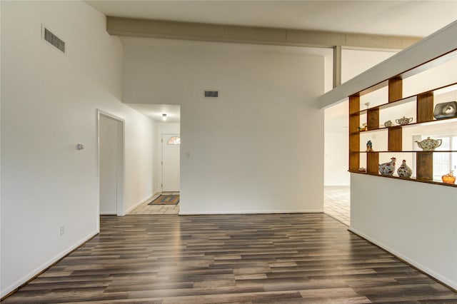 empty room with wood finished floors and baseboards