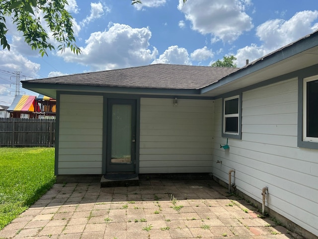 8515 Kempridge St, Houston, TX 77080 - back of property with a patio and roof with shingles