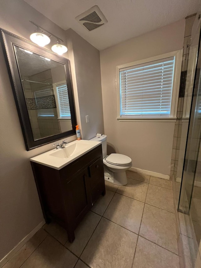 8515 Kempridge St, Houston, TX 77080 - bathroom with a shower stall, tile patterned flooring, vanity, toilet, and baseboards
