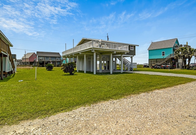 119 Nesmith Pl, Surfside Beach, TX 77541 - view of community featuring stairs, dirt driveway, a deck, and a yard