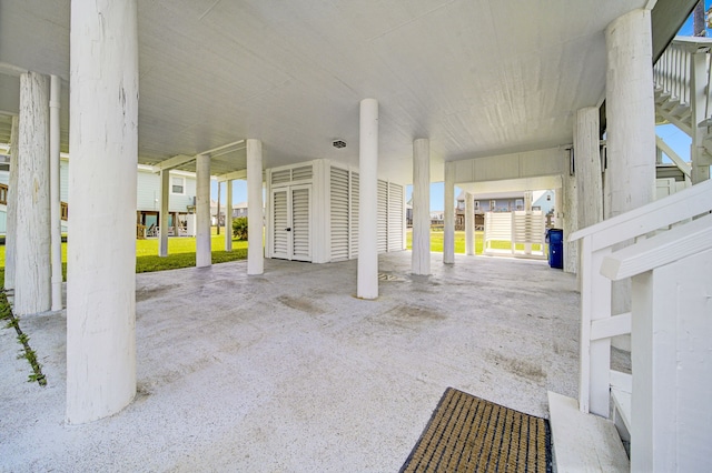119 Nesmith Pl, Surfside Beach, TX 77541 - view of patio / terrace with a carport and stairway