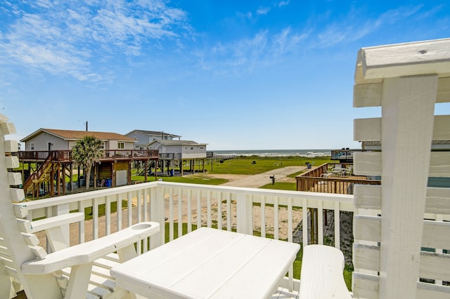 119 Nesmith Pl, Surfside Beach, TX 77541 - deck with a water view and outdoor dining area