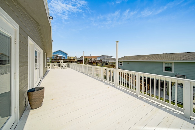 119 Nesmith Pl, Surfside Beach, TX 77541 - wooden deck with a residential view and central air condition unit