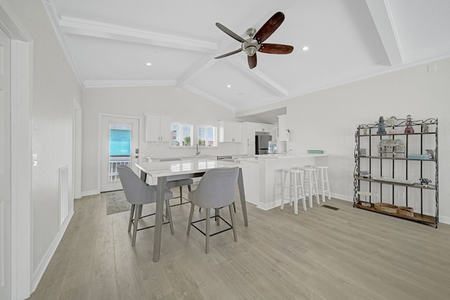 119 Nesmith Pl, Surfside Beach, TX 77541 - dining area featuring light wood-type flooring, ceiling fan, and baseboards