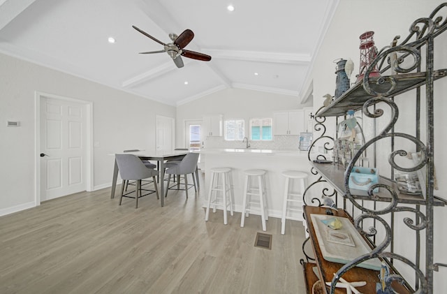 119 Nesmith Pl, Surfside Beach, TX 77541 - dining area with light wood finished floors, ceiling fan, baseboards, and recessed lighting