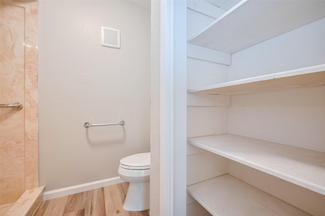 14555 Wunderlich Dr Unit 2307, Houston, TX 77069 - full bath with toilet, wood finished floors, baseboards, and tiled shower