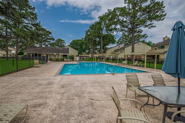 14555 Wunderlich Dr Unit 2307, Houston, TX 77069 - community pool with a patio area and fence