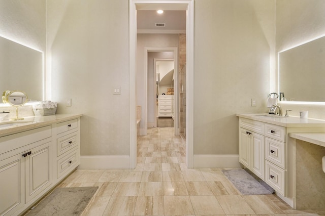 4606 W Alabama St, Houston, TX 77027 - full bathroom featuring baseboards, crown molding, and two vanities