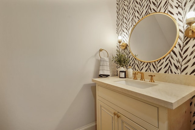 4606 W Alabama St, Houston, TX 77027 - bathroom with wallpapered walls, baseboards, and vanity