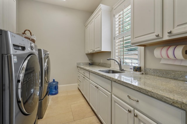 4606 W Alabama St, Houston, TX 77027 - laundry room featuring cabinet space, independent washer and dryer, healthy amount of natural light, and baseboards