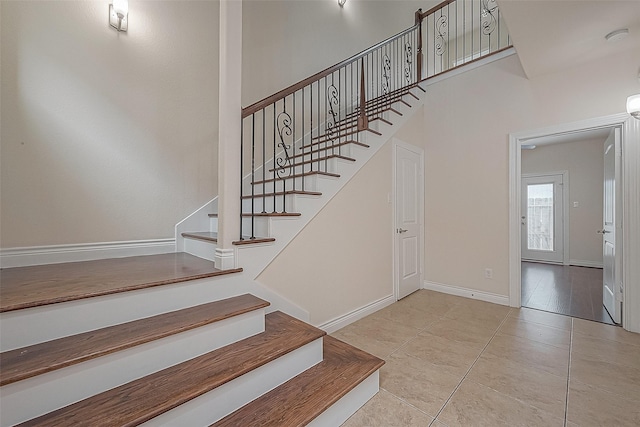 1606 Parker St, Houston, TX 77007 - stairway featuring tile patterned floors and baseboards