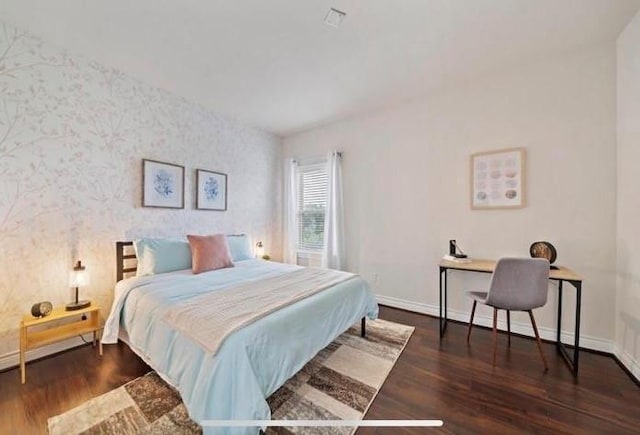 1606 Parker St, Houston, TX 77007 - bedroom with wallpapered walls, baseboards, and wood finished floors