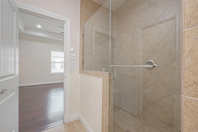 1606 Parker St, Houston, TX 77007 - full bath with ornamental molding, a shower stall, baseboards, and wood finished floors