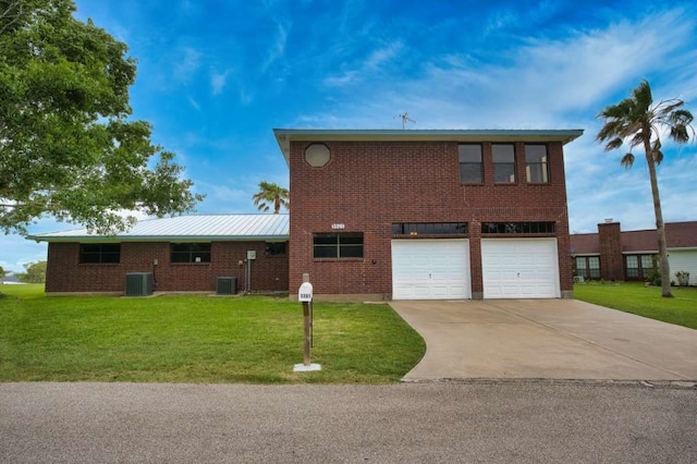 5361 County Road 868e, Brazoria, TX 77422 - traditional-style house featuring driveway, a garage, a front lawn, and central AC unit