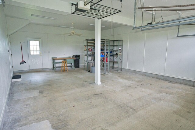 5361 County Road 868e, Brazoria, TX 77422 - garage with a garage door opener and a ceiling fan