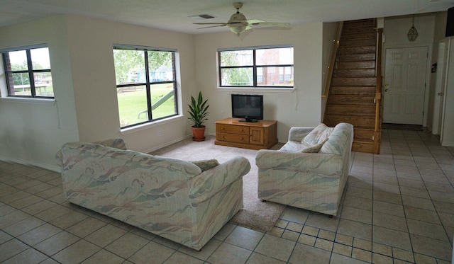 5361 County Road 868e, Brazoria, TX 77422 - living area with healthy amount of natural light, light tile patterned flooring, and stairway