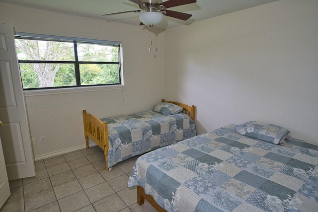 5361 County Road 868e, Brazoria, TX 77422 - bedroom with light tile patterned flooring, baseboards, and a ceiling fan