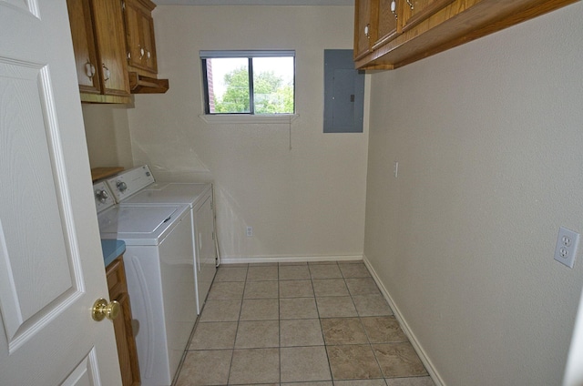 5361 County Road 868e, Brazoria, TX 77422 - washroom with electric panel, cabinet space, washer and clothes dryer, baseboards, and light tile patterned flooring