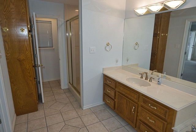 5361 County Road 868e, Brazoria, TX 77422 - bathroom featuring a shower stall, tile patterned floors, vanity, and baseboards