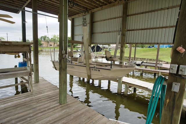 5361 County Road 868e, Brazoria, TX 77422 - dock with boat lift and a water view