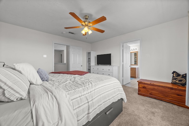 15914 Langhamwood Ln, Houston, TX 77084 - bedroom featuring light carpet, a ceiling fan, and ensuite bath