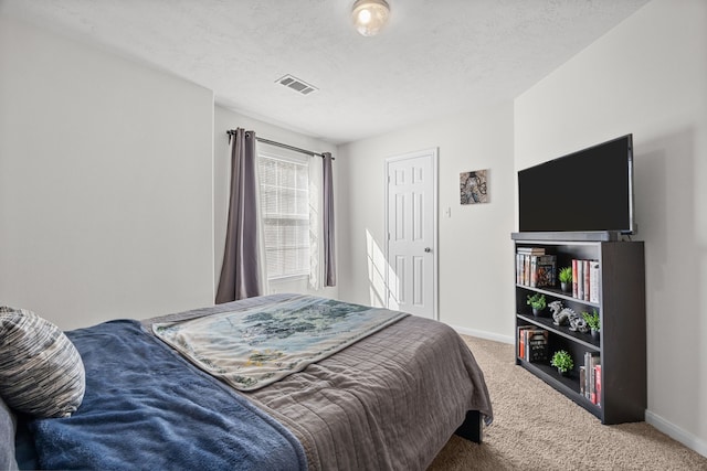 15914 Langhamwood Ln, Houston, TX 77084 - bedroom featuring carpet floors, baseboards, and a textured ceiling