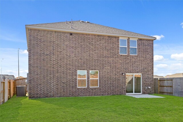 27214 Leeward Jetty Dr, Katy, TX 77493 - rear view of property with central AC, brick siding, and a patio