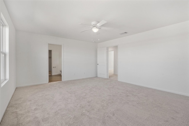 27214 Leeward Jetty Dr, Katy, TX 77493 - unfurnished bedroom featuring carpet flooring, baseboards, a ceiling fan, and ensuite bathroom