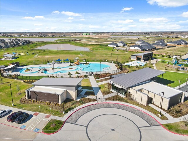 27214 Leeward Jetty Dr, Katy, TX 77493 - aerial view of residential area featuring a pool area and a large body of water