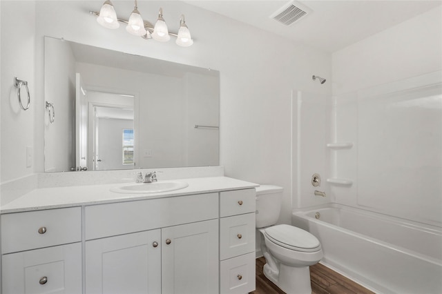 27214 Leeward Jetty Dr, Katy, TX 77493 - full bathroom featuring toilet, wood finished floors, vanity, and shower / tub combination