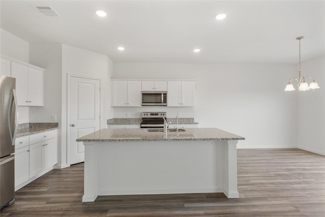 27214 Leeward Jetty Dr, Katy, TX 77493 - kitchen featuring appliances with stainless steel finishes, a sink, a kitchen island with sink, white cabinetry, and recessed lighting