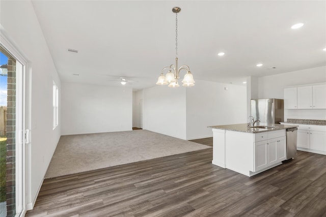 27214 Leeward Jetty Dr, Katy, TX 77493 - kitchen with a sink, appliances with stainless steel finishes, dark wood-style floors, open floor plan, and recessed lighting