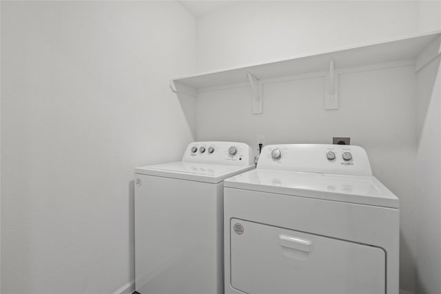 27214 Leeward Jetty Dr, Katy, TX 77493 - clothes washing area featuring washer and clothes dryer and baseboards