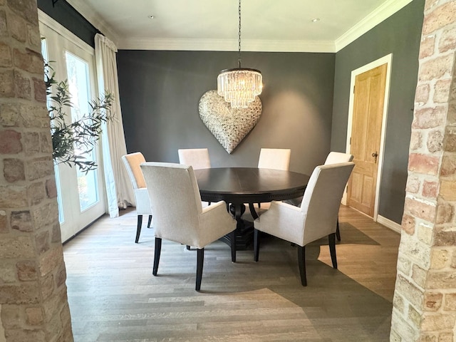 3911 Swarthmore St, Houston, TX 77005 - dining area featuring a chandelier, plenty of natural light, wood finished floors, and crown molding