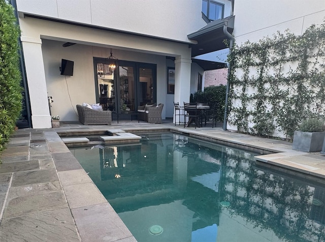 3911 Swarthmore St, Houston, TX 77005 - view of swimming pool featuring a pool with connected hot tub, outdoor lounge area, and a patio area