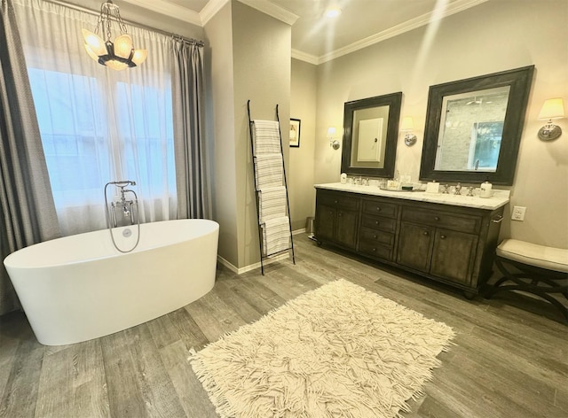3911 Swarthmore St, Houston, TX 77005 - full bath with wood finished floors, ornamental molding, a chandelier, a freestanding tub, and double vanity