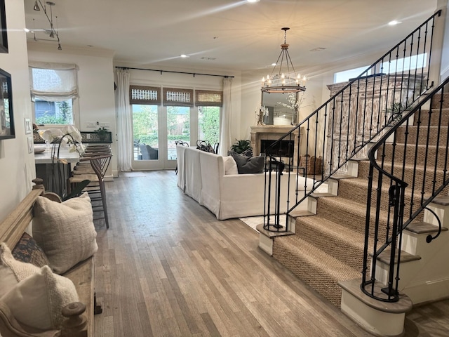 3911 Swarthmore St, Houston, TX 77005 - living area with wood finished floors, stairs, plenty of natural light, a chandelier, and recessed lighting