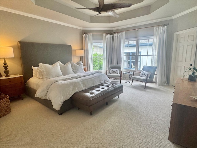 3911 Swarthmore St, Houston, TX 77005 - carpeted bedroom featuring a tray ceiling, crown molding, and a ceiling fan