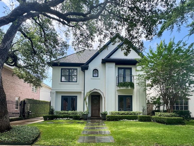3911 Swarthmore St, Houston, TX 77005 - french country home featuring french doors, stucco siding, a balcony, a gate, and a shingled roof