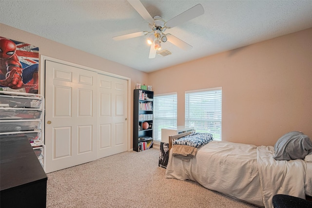 carpeted bedroom featuring a ceiling fan