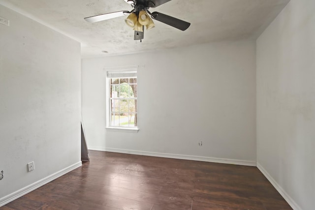 2211 Willow Point Dr, Houston, TX 77339 - spare room featuring a ceiling fan, dark wood-style floors, and baseboards