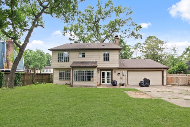 2211 Willow Point Dr, Houston, TX 77339 - rear view of property with french doors, driveway, a chimney, and a garage