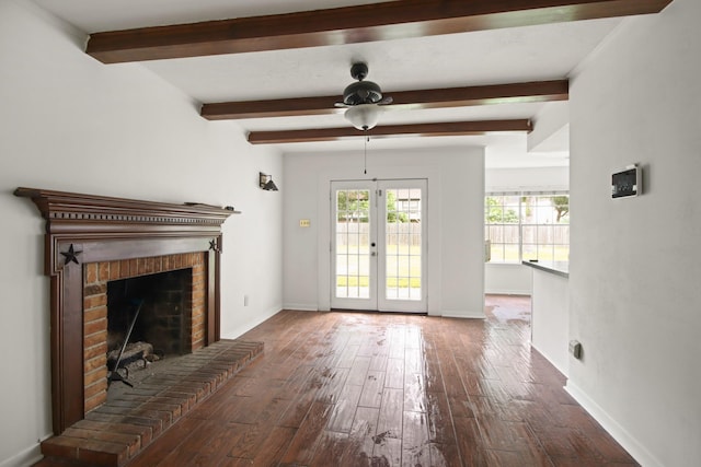 2211 Willow Point Dr, Houston, TX 77339 - unfurnished living room featuring a ceiling fan, beamed ceiling, wood finished floors, baseboards, and a brick fireplace