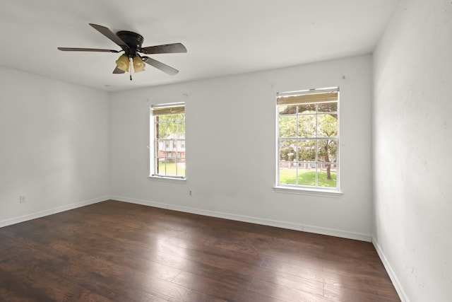 2211 Willow Point Dr, Houston, TX 77339 - empty room with dark wood finished floors, a ceiling fan, and baseboards