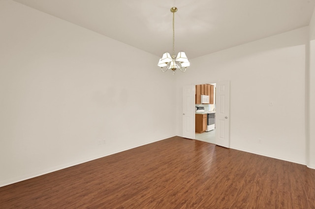 3722 Lovers Ln, Montgomery, TX 77356 - empty room with a chandelier, wood finished floors, and baseboards
