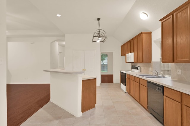 3722 Lovers Ln, Montgomery, TX 77356 - kitchen with white appliances, a sink, light countertops, brown cabinetry, and light tile patterned floors